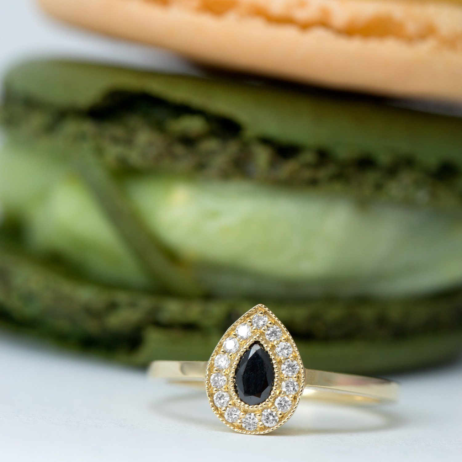pear black diamond on a gold ring