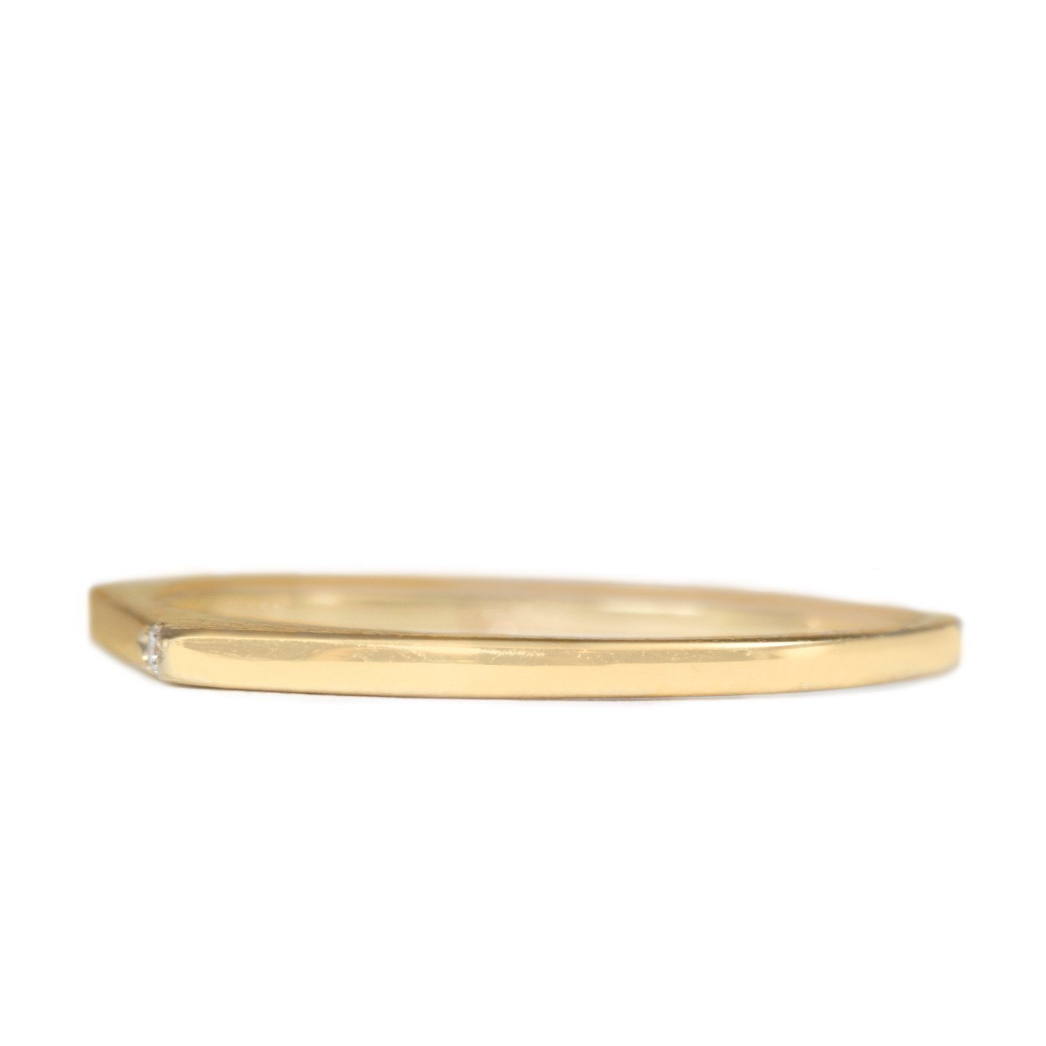 very thin gold ring with white diamond