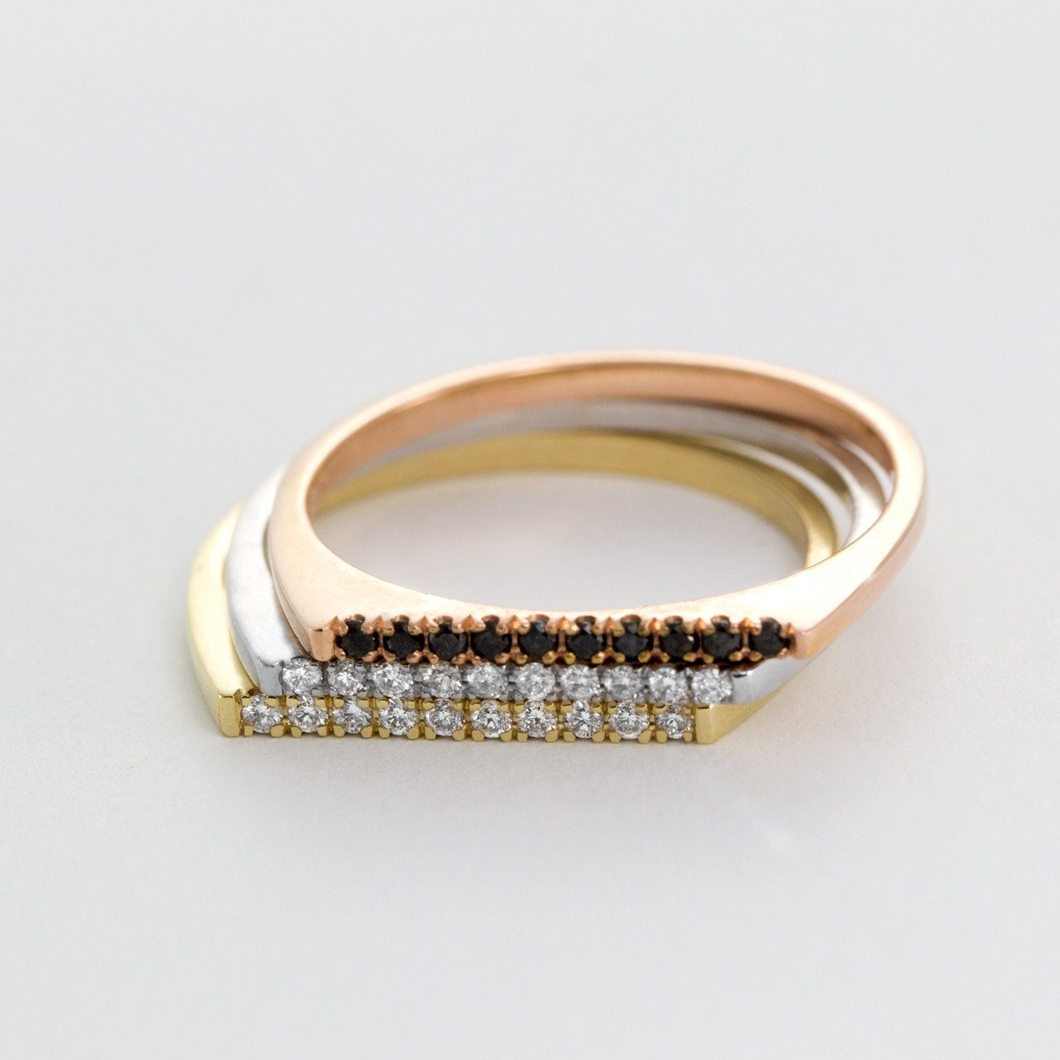 gold thin ring with row of diamonds